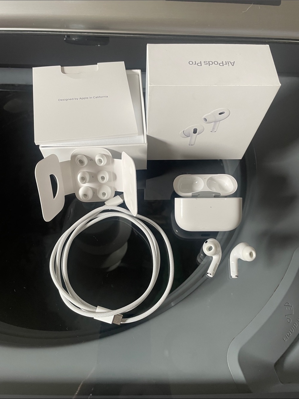 Apple AirPods Pro with White Charging Case and Cable